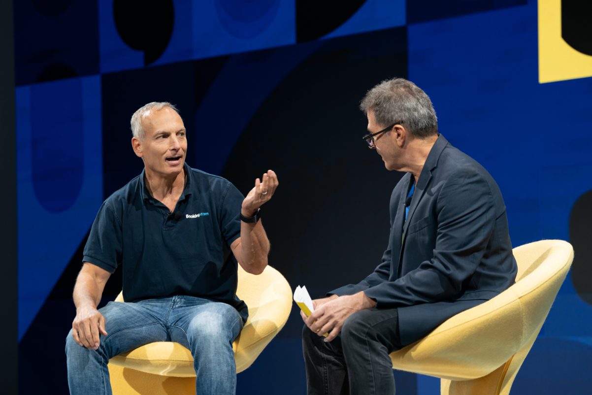 Glenn Gogel, Booking Holdings CEO (left) with Skift's Dennis Schaal at Skift Global Forum in September 2022 in New York City. Fogel said Booking made market share gains in the U.S. in 2022.